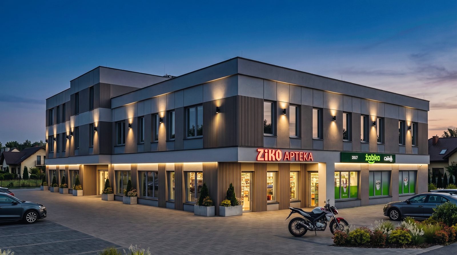 Wizualizacja Corner 48 o zmierzchu - podświetlone witryny parteru i iluminacja elewacji